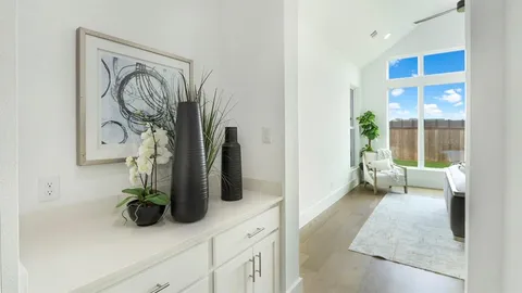 a bathroom with a granite countertop sink a mirror and shower