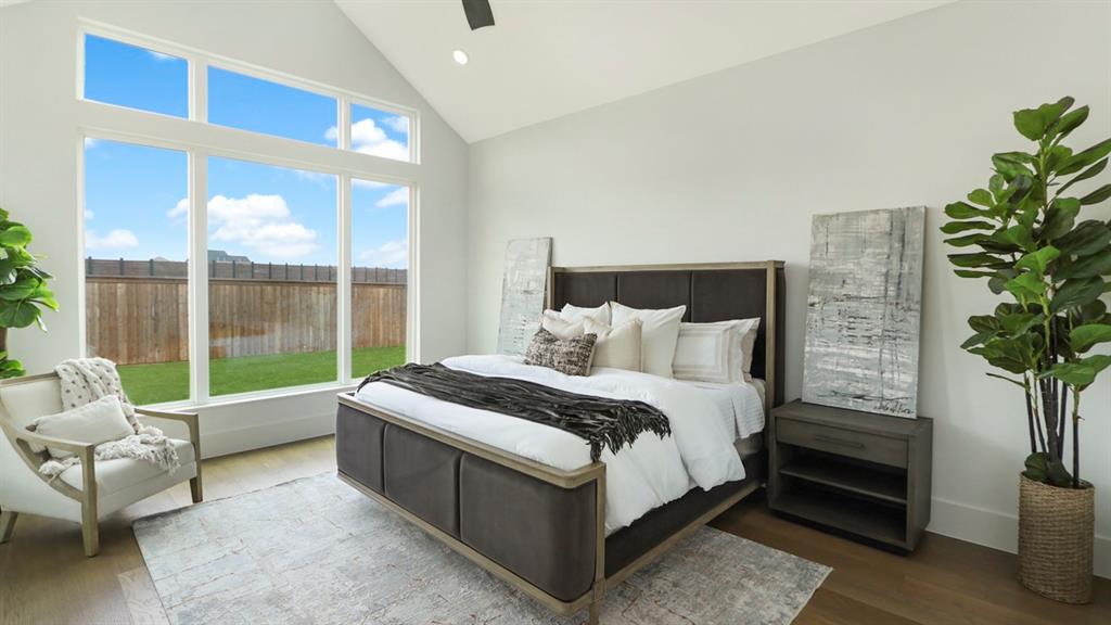 165 Lantern Ridge Drive Aledo, TX 76008 - Photo 35 of 38 a bed sitting in a bedroom next to a window