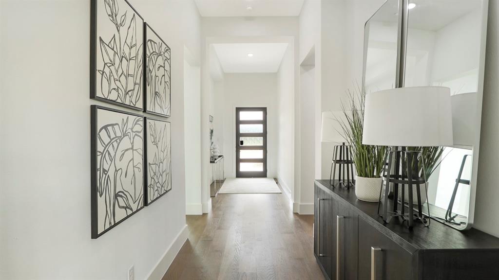 165 Lantern Ridge Drive Aledo, TX 76008 - Photo 37 of 38 view of a hallway with wooden floor and stairs