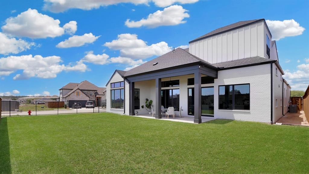 165 Lantern Ridge Drive Aledo, TX 76008 - Photo 4 of 38 a view of a house with a yard and potted plants