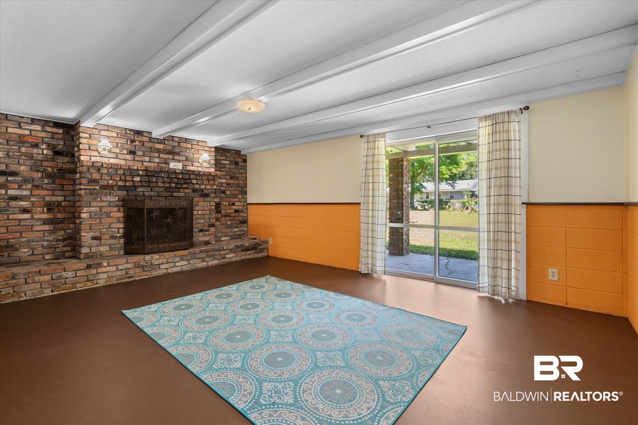 706 Sutherland Drive Chickasaw, AL 36611 - Photo 23 of 33 Unfurnished living room featuring a fireplace, beamed ceiling, and wainscoting