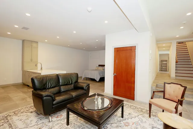 a living room with furniture and a rug