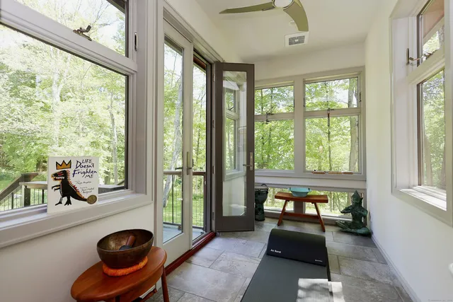 a bedroom with furniture and a window