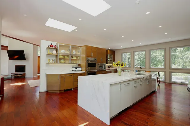 a large kitchen with stainless steel appliances lots of counter top space
