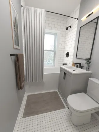 a bathroom with a sink a toilet a window and a shower