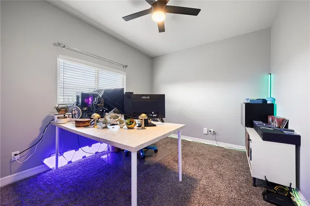 a view of a workspace with furniture