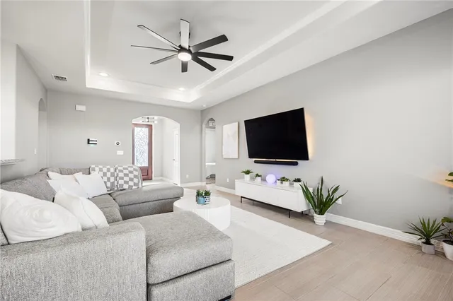 a living room with furniture and a flat screen tv
