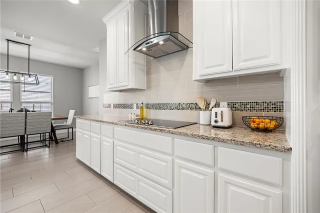 a kitchen with stainless steel appliances granite countertop a sink and cabinets
