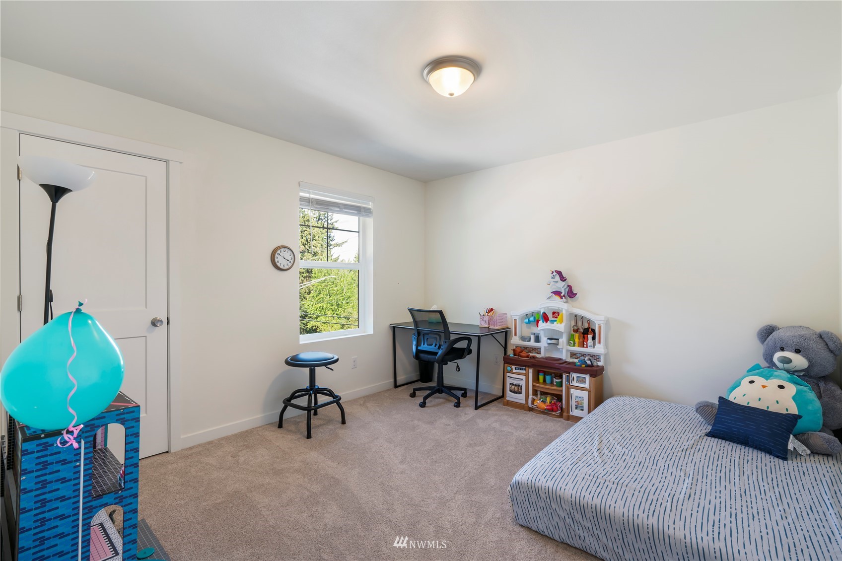 19512 Damson Road, Unit A Lynnwood, WA 98036 - Photo 28 of 37 a bedroom with furniture and a chair