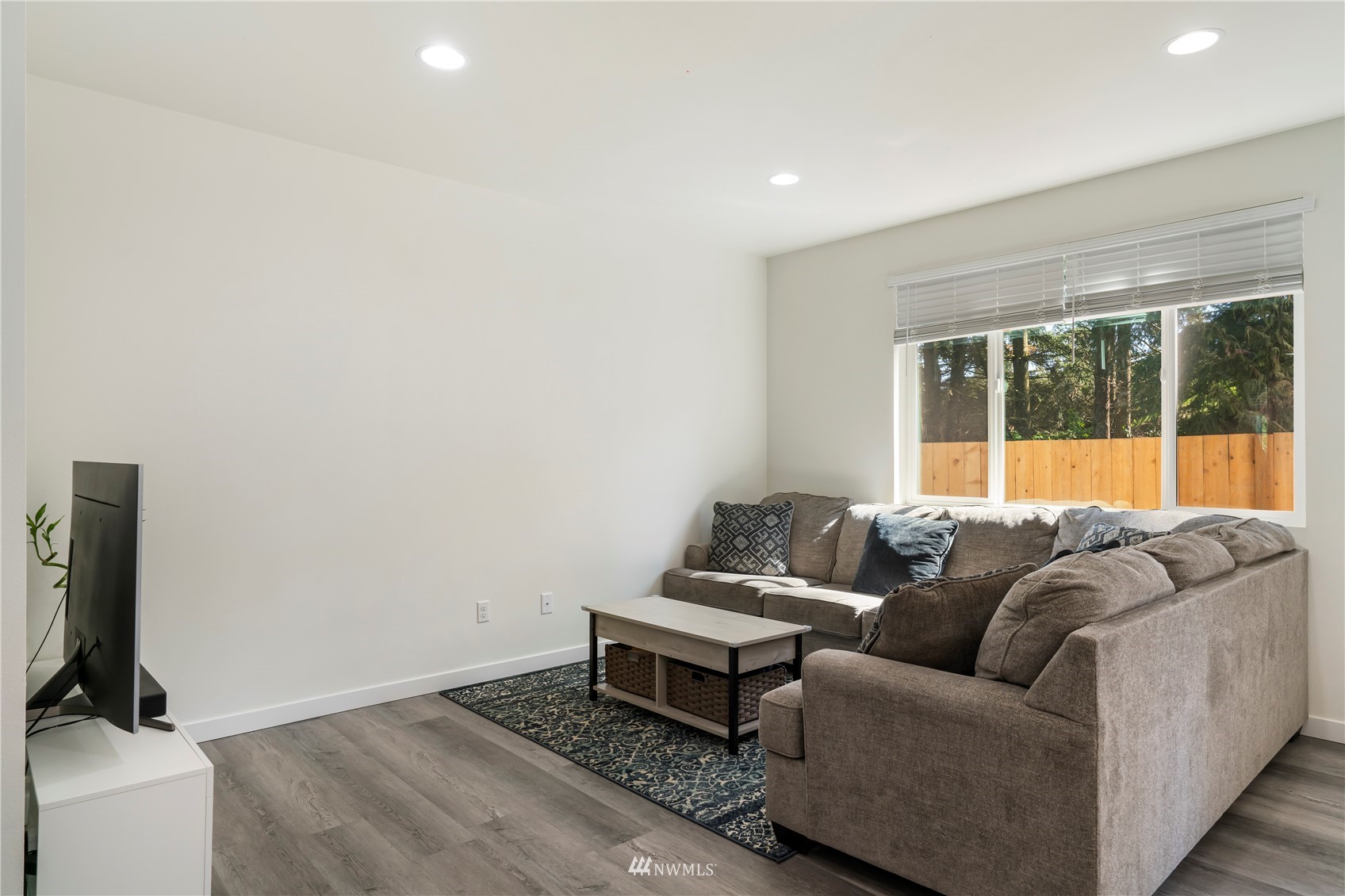 19512 Damson Road, Unit A Lynnwood, WA 98036 - Photo 5 of 37 a living room with furniture and a flat screen tv