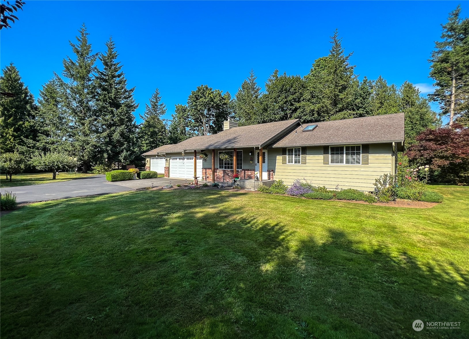 247 West Bartlett Road Lynden, WA 98264 - Photo 1 of 26 a house with swimming pool in front of it
