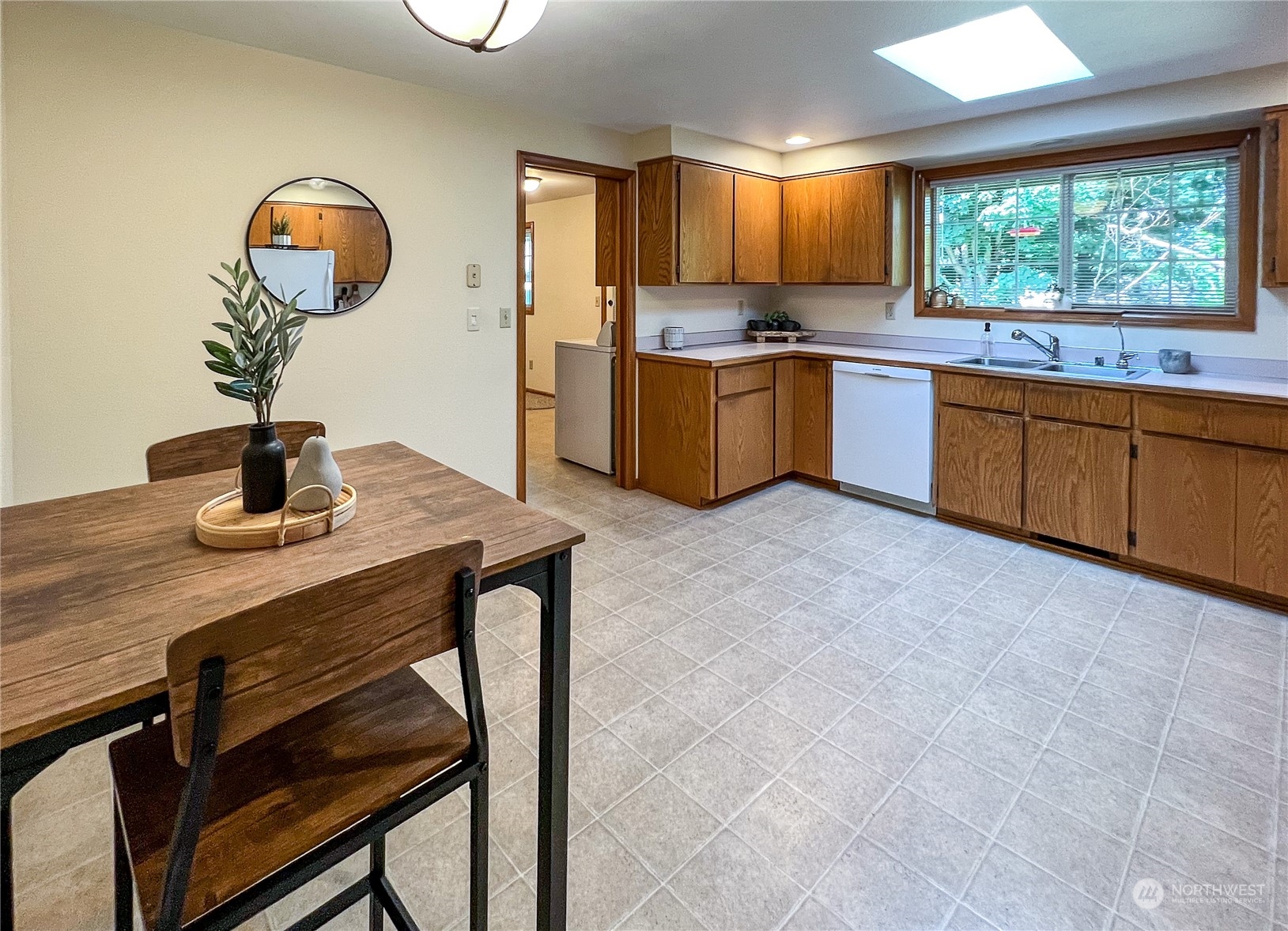 247 West Bartlett Road Lynden, WA 98264 - Photo 9 of 26 a kitchen with a sink cabinets and window