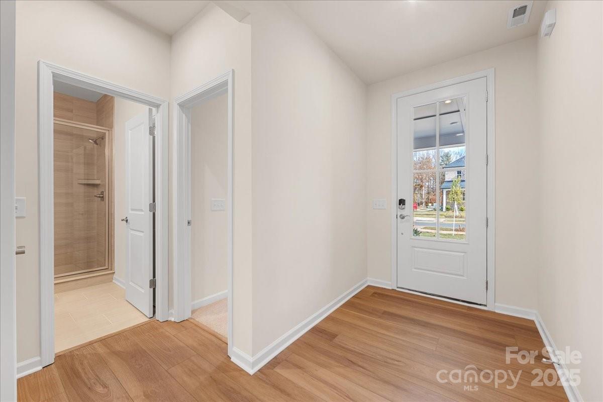 8233 Franklin Trl Street Mint Hill, NC 28227 - Photo 4 of 17 a view of empty room with wooden floor