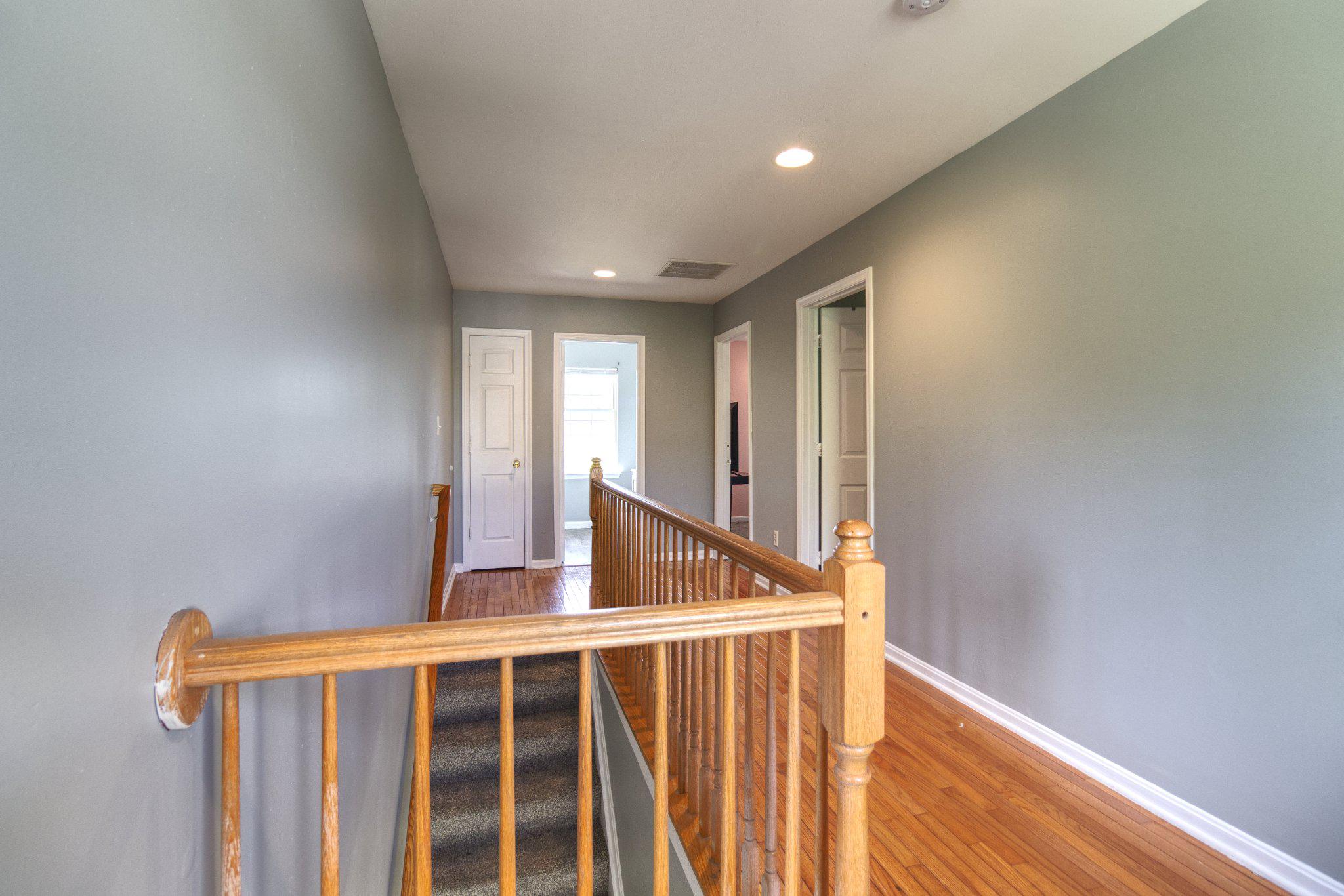 215 Seamaster Road Essex, MD 21221 - Photo 17 of 40 a view of staircase with wooden floor