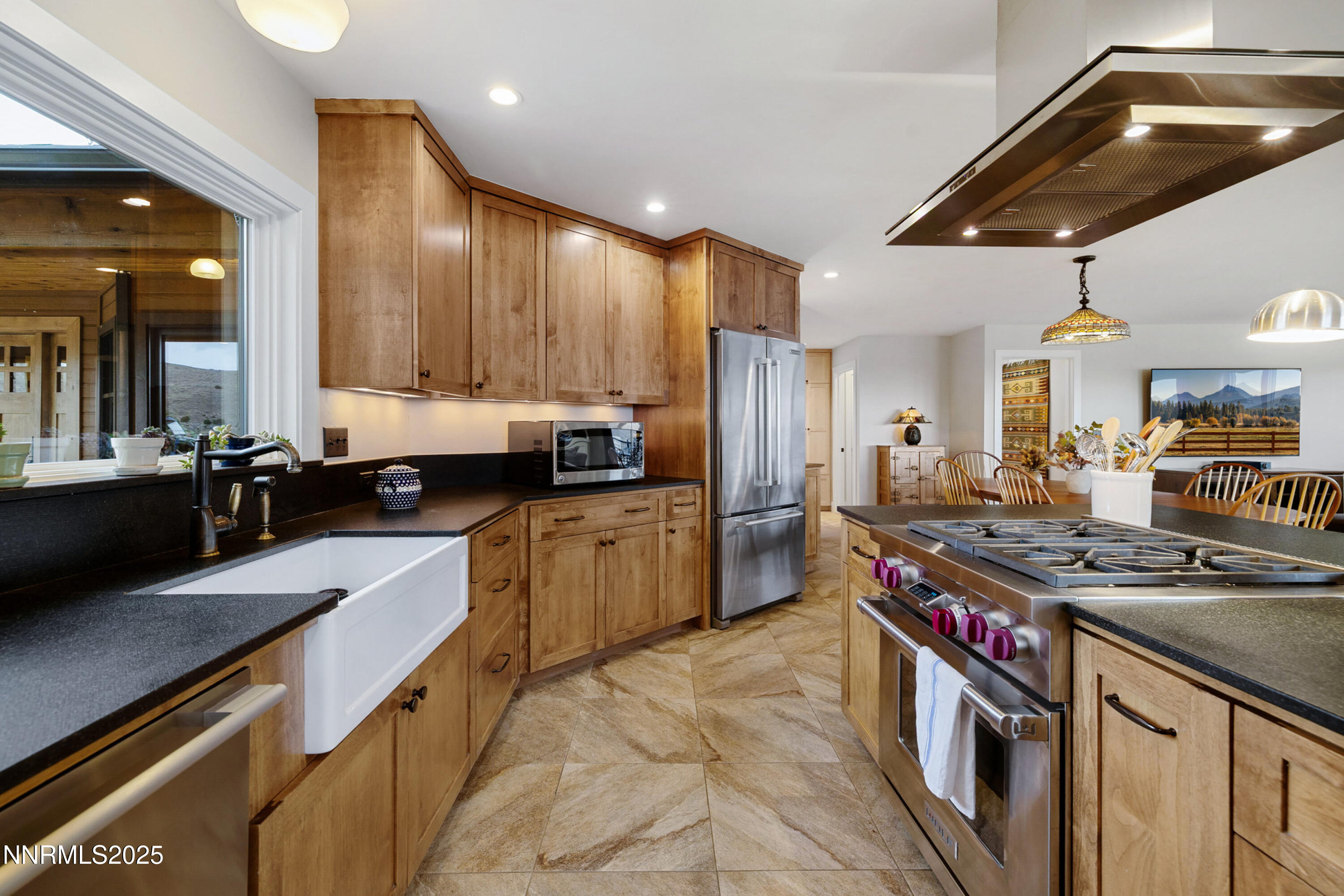 110 Moonstone Lane Reno, NV 89508 - Photo 13 of 68 a kitchen with stainless steel appliances granite countertop a stove a sink dishwasher and a refrigerator