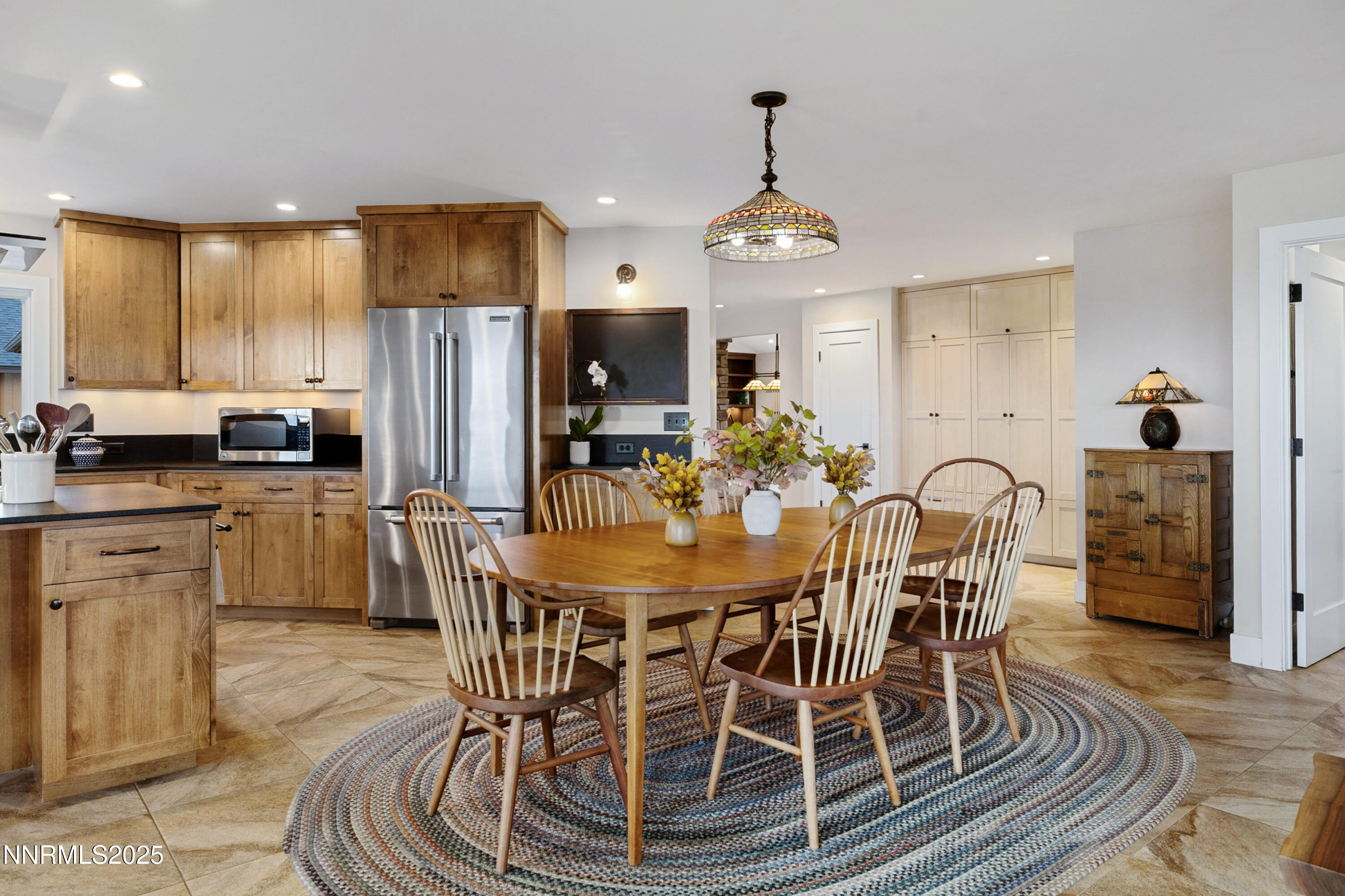 110 Moonstone Lane Reno, NV 89508 - Photo 16 of 68 a view of a dining room with furniture a chandelier and wooden floor
