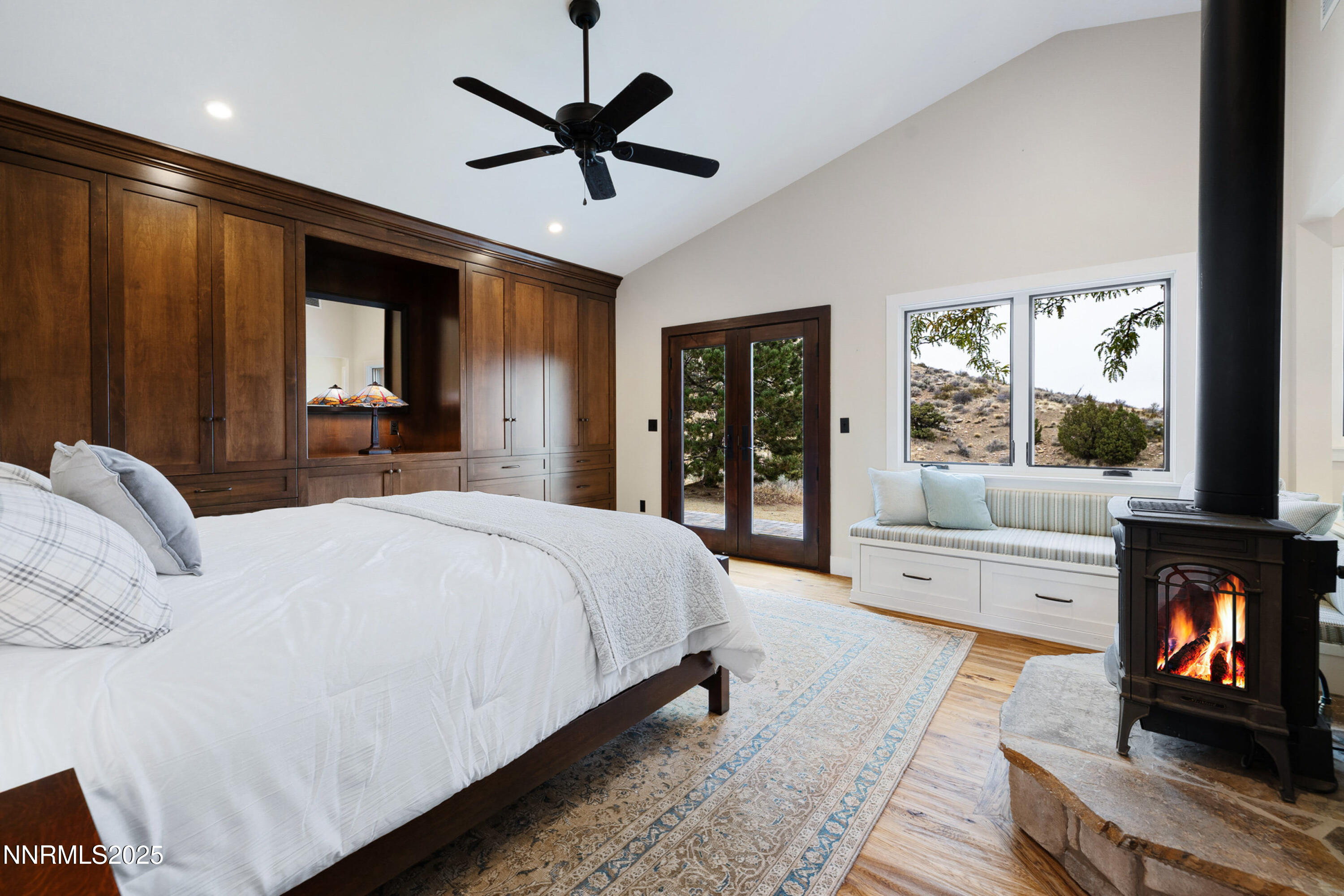 110 Moonstone Lane Reno, NV 89508 - Photo 22 of 68 a bedroom with a large bed and a tv