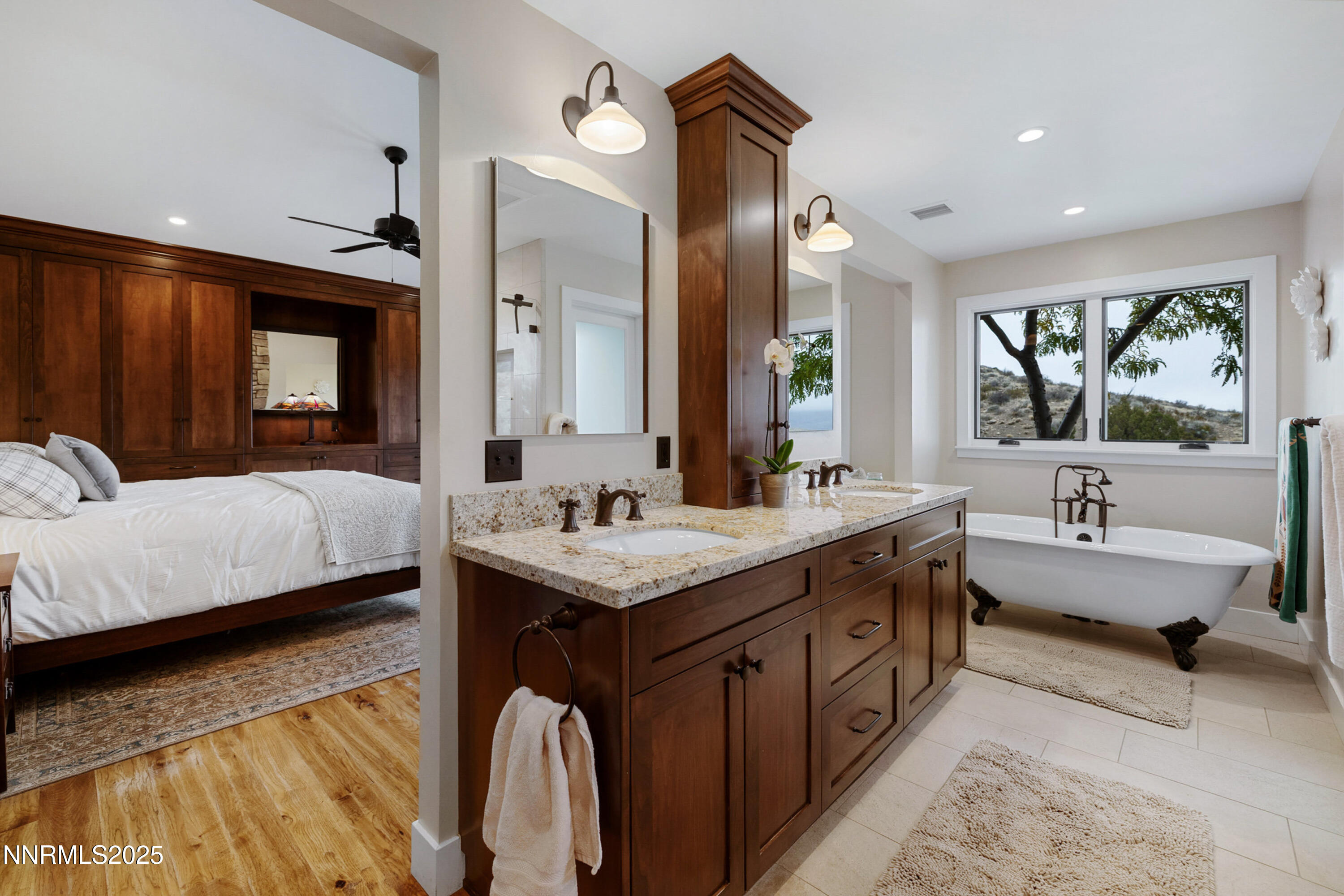 110 Moonstone Lane Reno, NV 89508 - Photo 24 of 68 a en suite bathroom with a granite countertop double vanity sink a mirror and a bathtub
