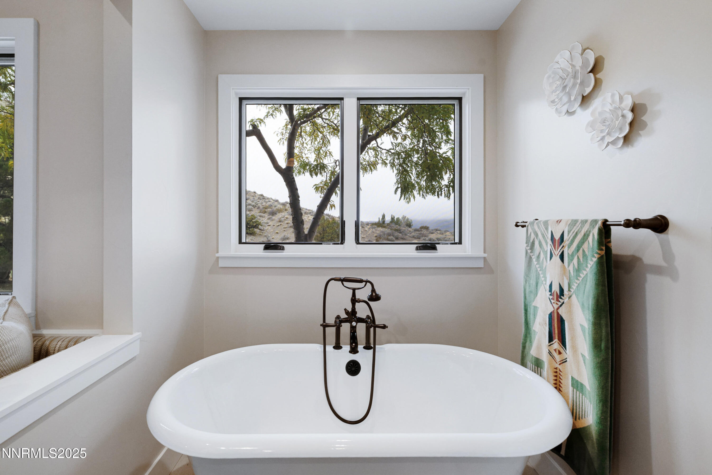 110 Moonstone Lane Reno, NV 89508 - Photo 25 of 68 a bathroom with a sink and mirror with window