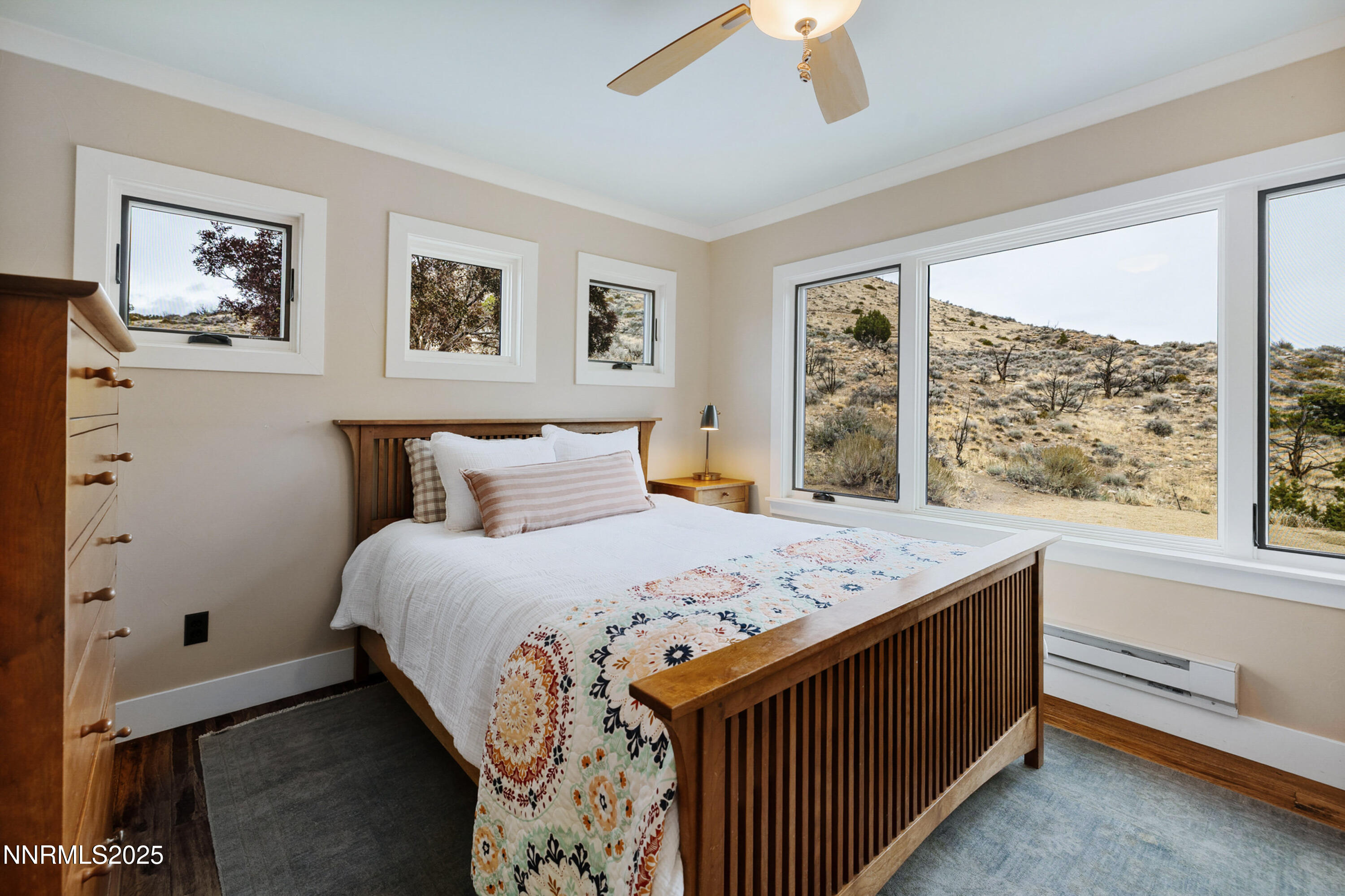110 Moonstone Lane Reno, NV 89508 - Photo 28 of 68 a bedroom with a bed and a large window