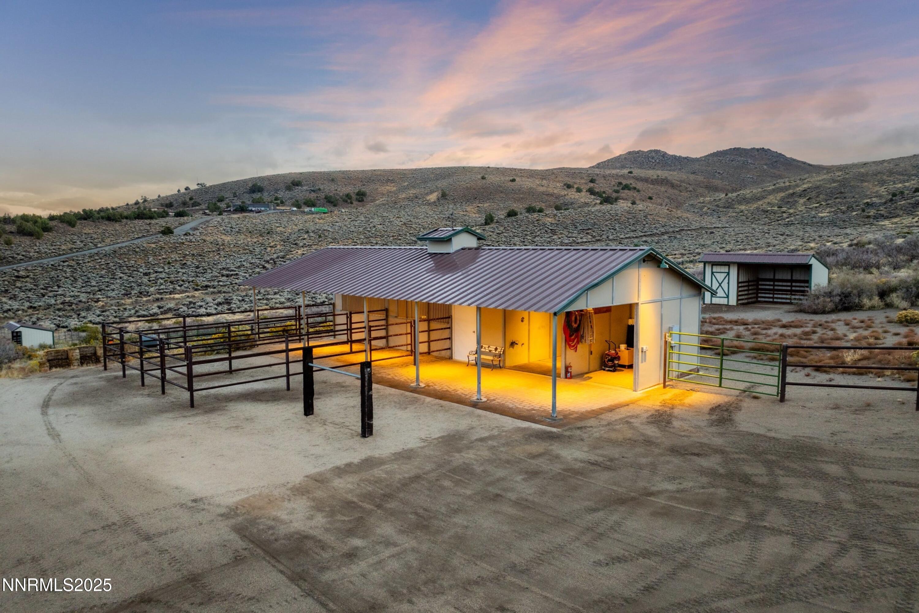 110 Moonstone Lane Reno, NV 89508 - Photo 51 of 68 an aerial view of a house with swimming pool and mountain view