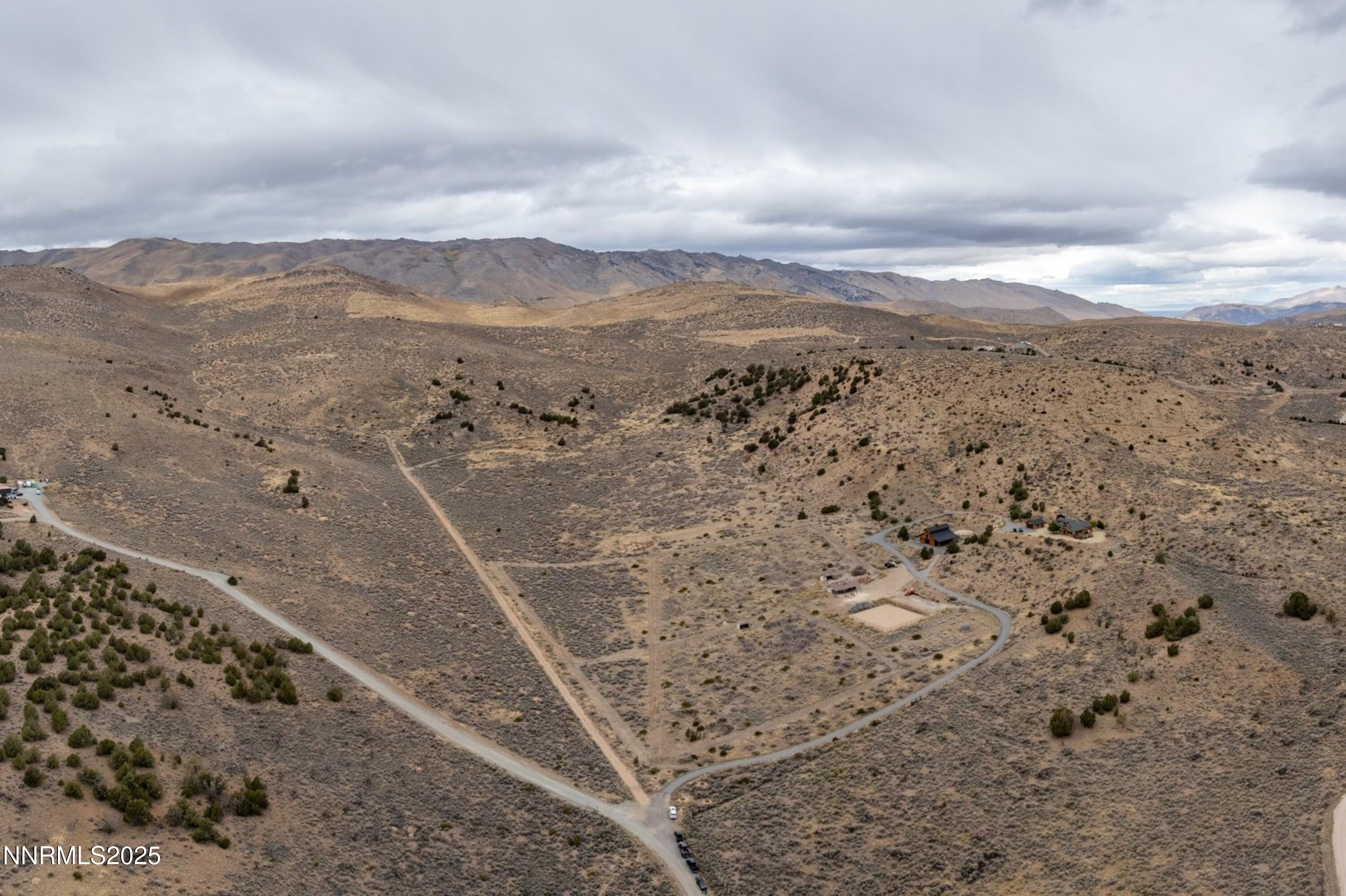 110 Moonstone Lane Reno, NV 89508 - Photo 63 of 68 a view of a dry yard with mountains in the background