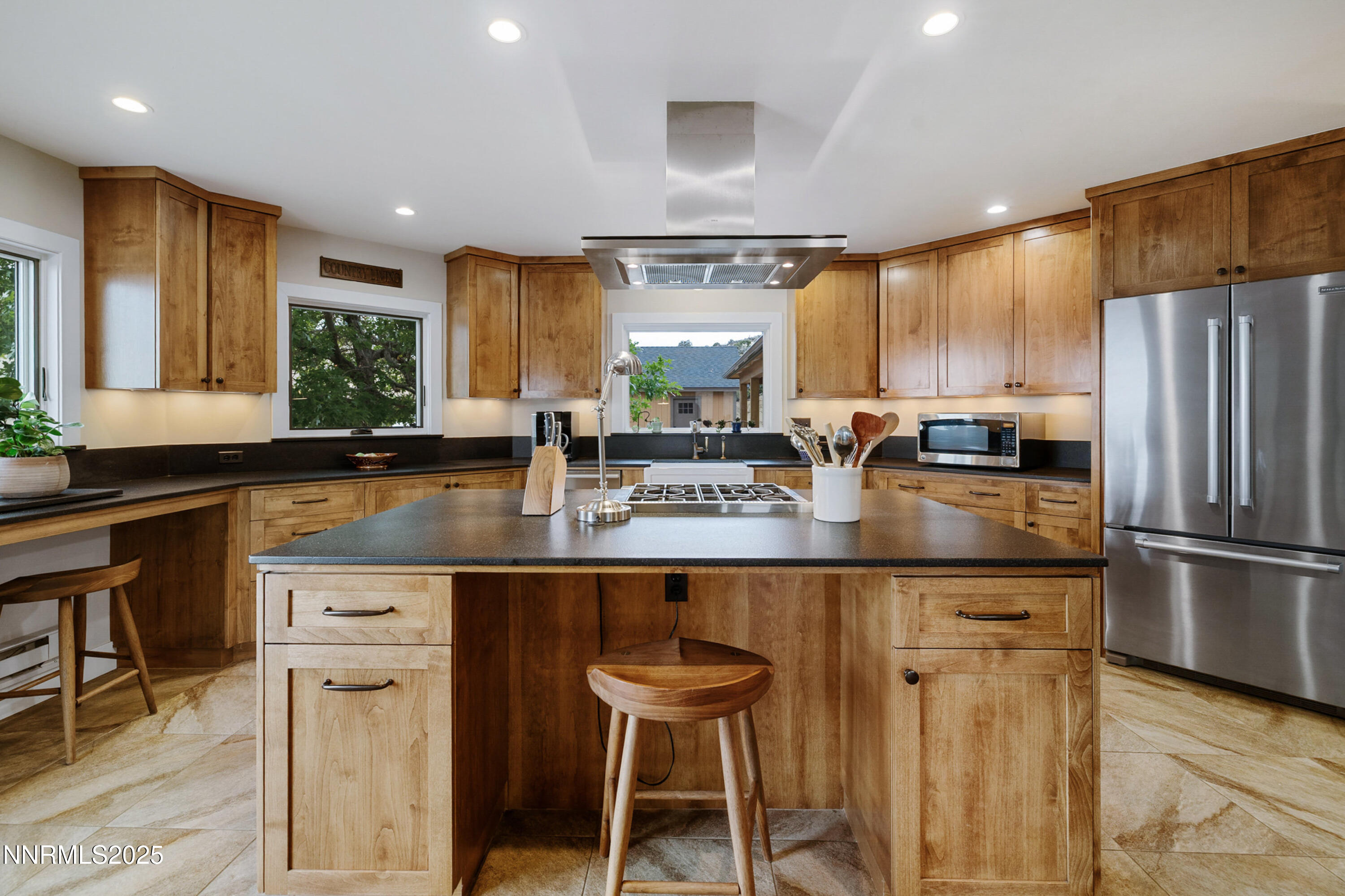 110 Moonstone Lane Reno, NV 89508 - Photo 8 of 68 a kitchen with stainless steel appliances granite countertop table chairs sink and cabinets