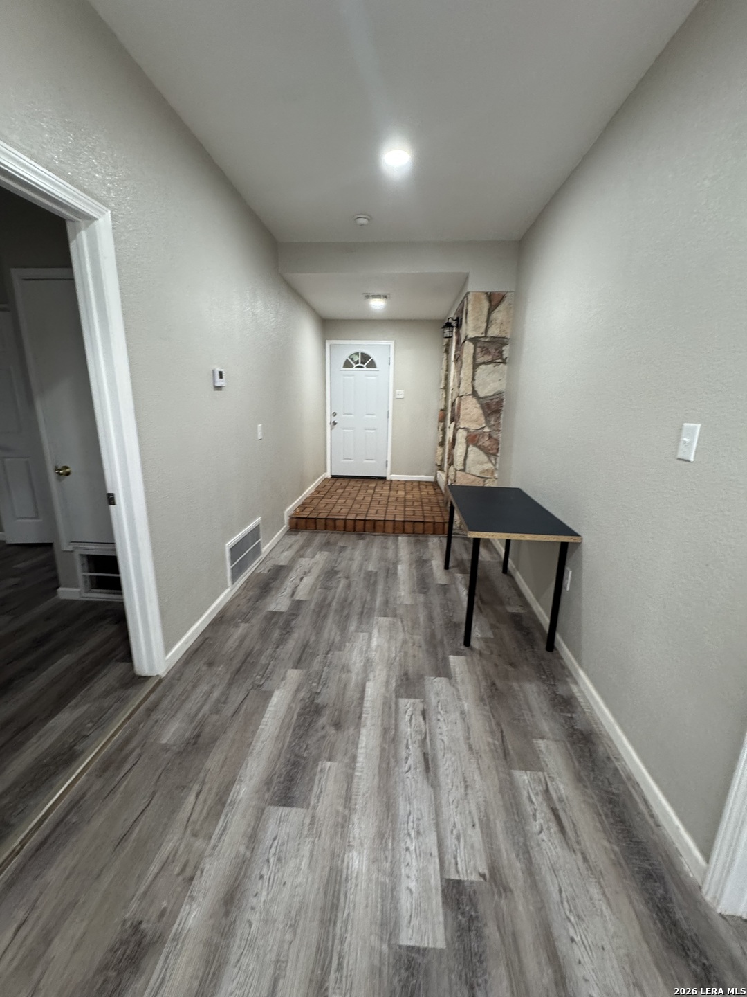 1240 Rice Road San Antonio, TX 78220 - Photo 21 of 45 a view of an empty room and wooden floor