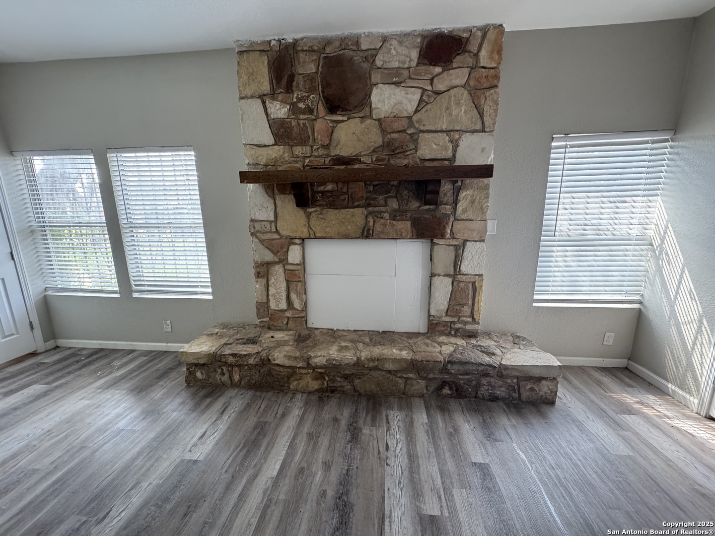 1240 Rice Road San Antonio, TX 78220 - Photo 26 of 45 a living room with furniture and wooden floor
