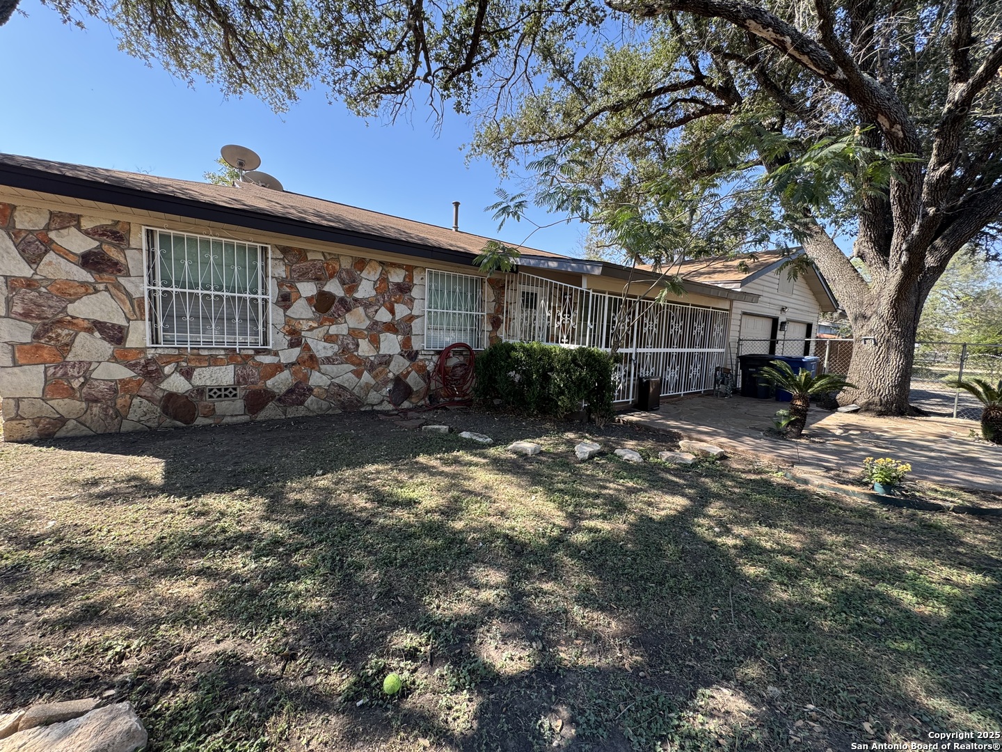 1240 Rice Road San Antonio, TX 78220 - Photo 3 of 45 a view of a house with a yard