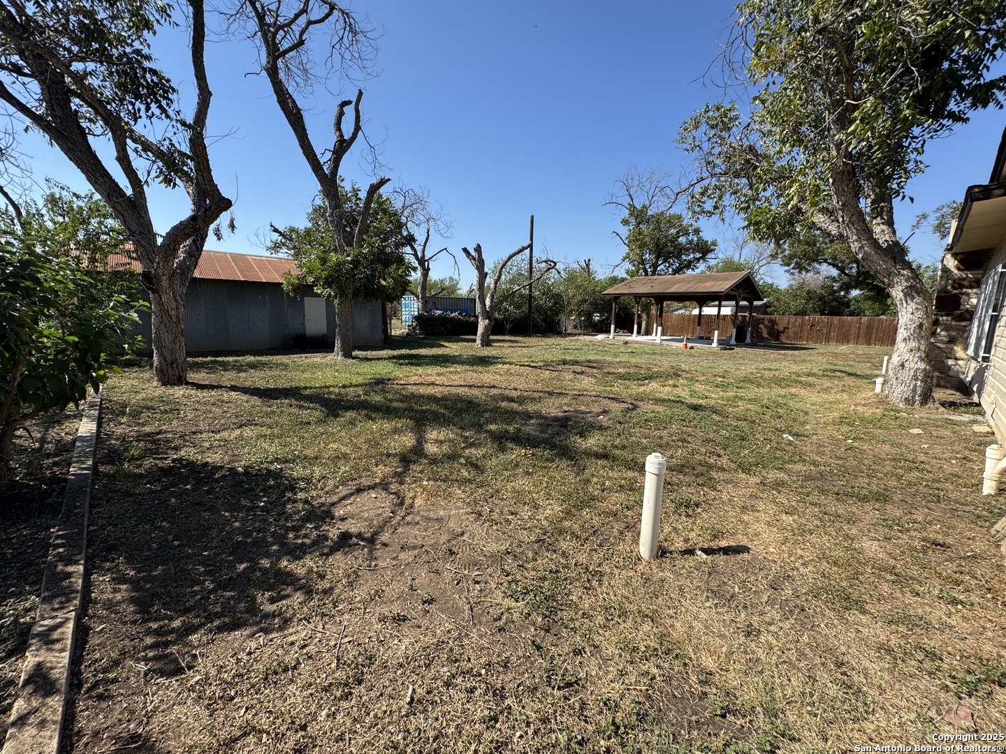 1240 Rice Road San Antonio, TX 78220 - Photo 33 of 45 a front view of a house with garden