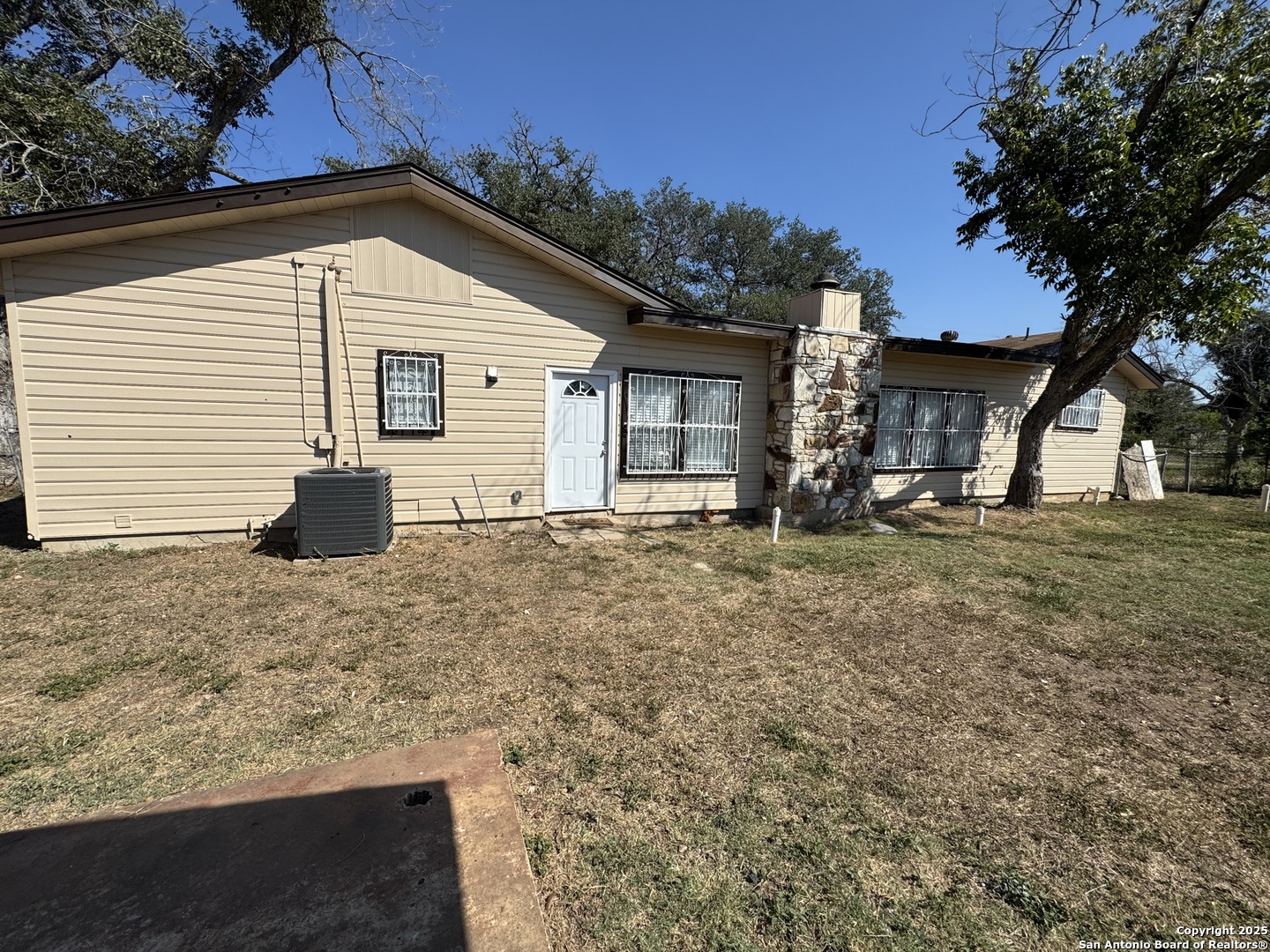 1240 Rice Road San Antonio, TX 78220 - Photo 35 of 45 a view of a house with a yard