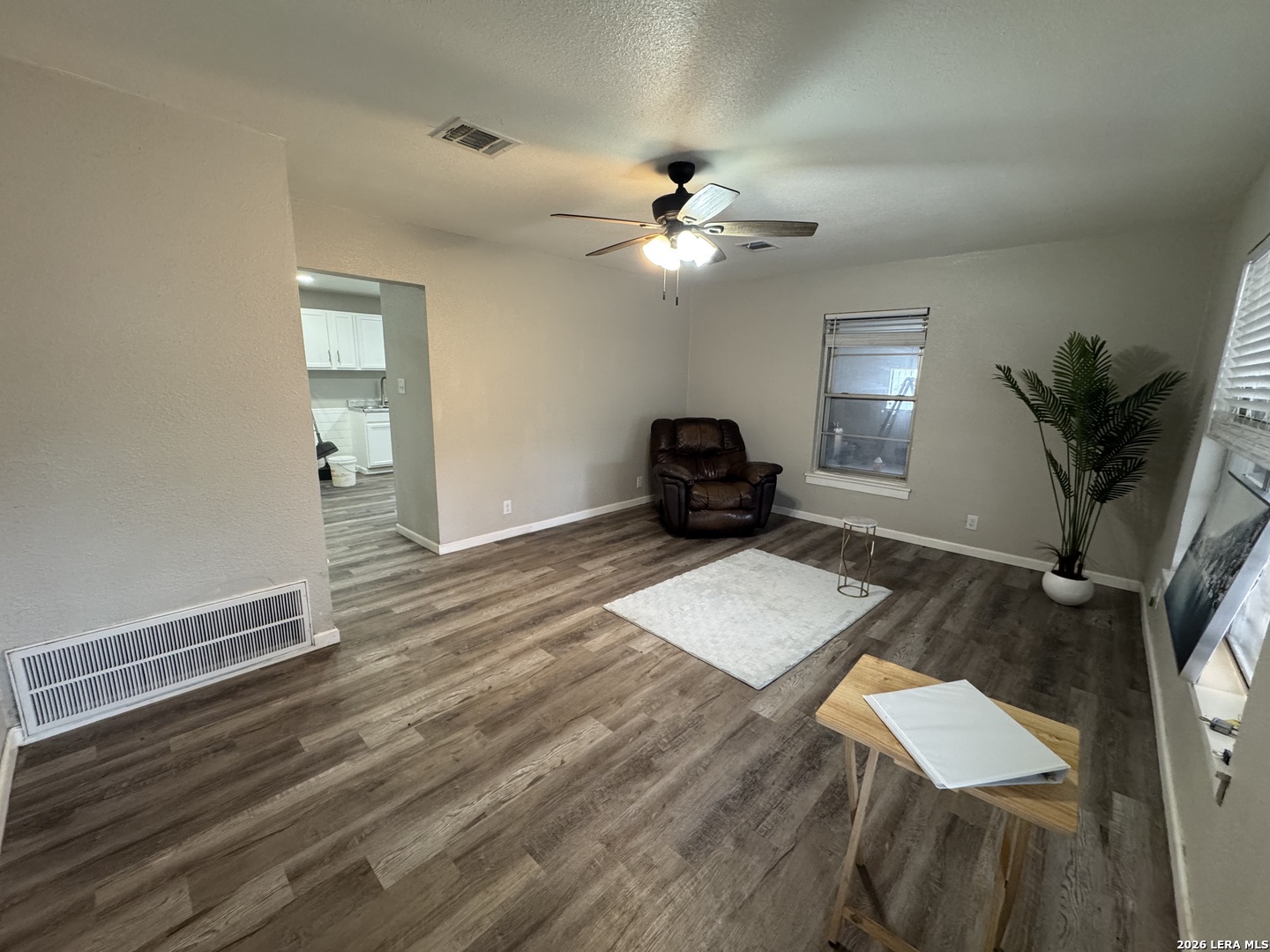 1240 Rice Road San Antonio, TX 78220 - Photo 4 of 45 a living room with furniture and a chandelier
