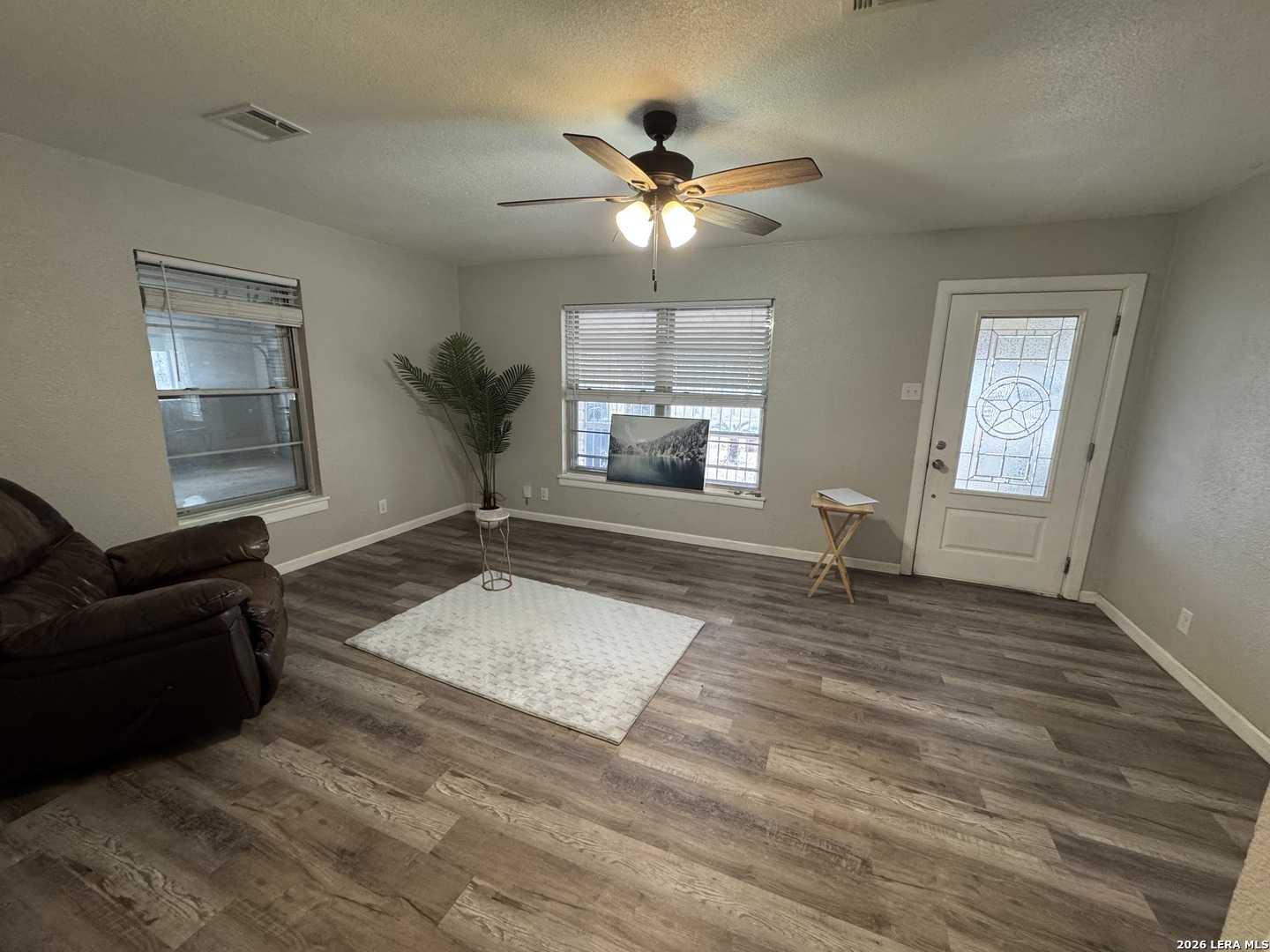1240 Rice Road San Antonio, TX 78220 - Photo 5 of 45 a living room with furniture and a chandelier