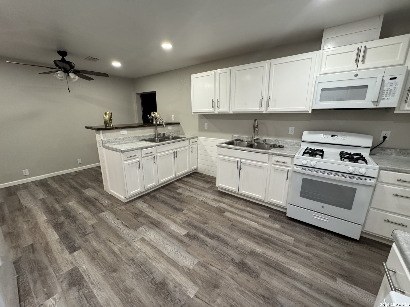 1240 Rice Road San Antonio, TX 78220 - Photo 6 of 45 a kitchen with a sink stove and cabinets