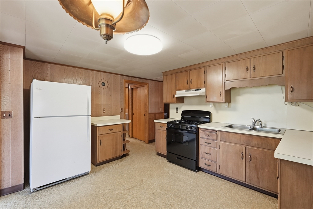 15 Main Street Hatfield, MA 01038 - Photo 9 of 42 a kitchen with a sink a stove and refrigerator