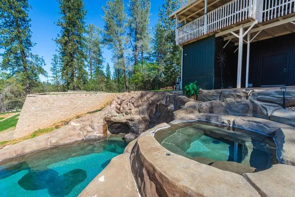 a bedroom with a bed and a cabinet