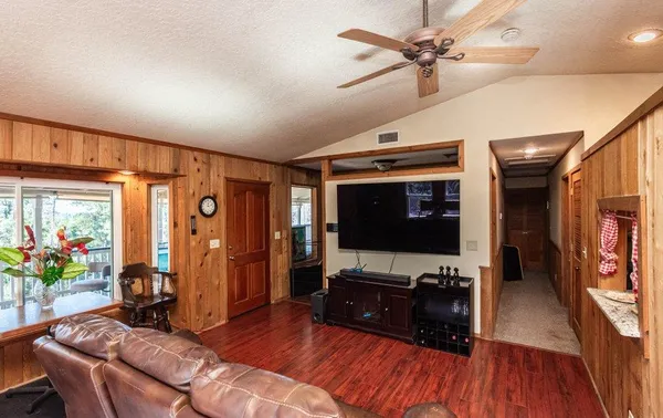 a kitchen with a refrigerator a stove top oven a sink dishwasher and wooden cabinets