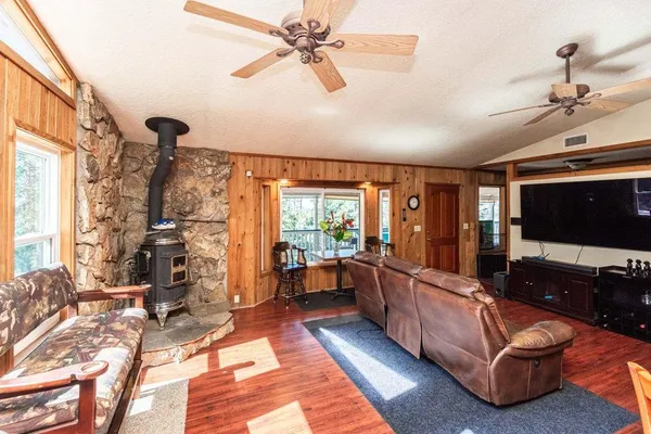 a kitchen with stainless steel appliances granite countertop a stove sink and cabinets