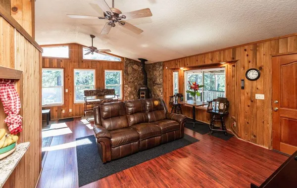 an aerial view of a house with a yard and garden