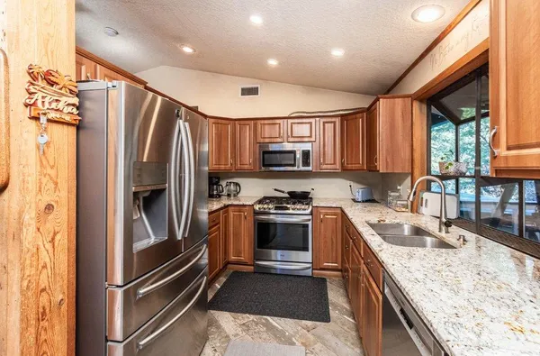 a view of a park with large trees