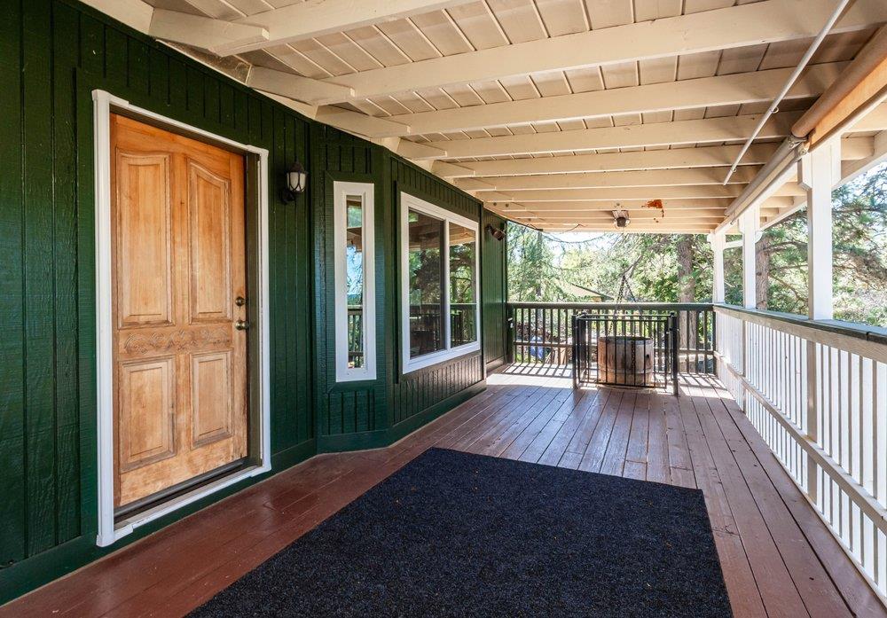23870 Tokayana Way Colfax, CA 95713 - Photo 57 of 93 a view of porch with wooden floor and floor to ceiling windows with wooden floor