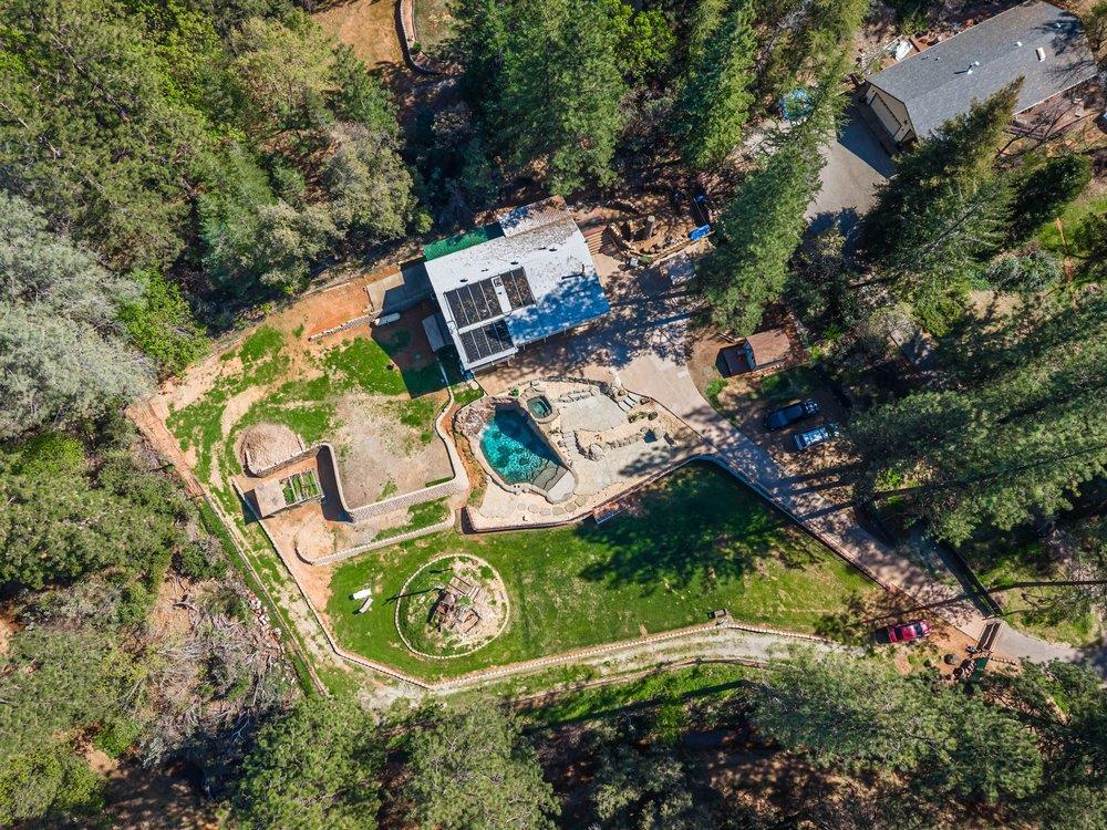 23870 Tokayana Way Colfax, CA 95713 - Photo 77 of 93 an aerial view of a house with a yard and large trees