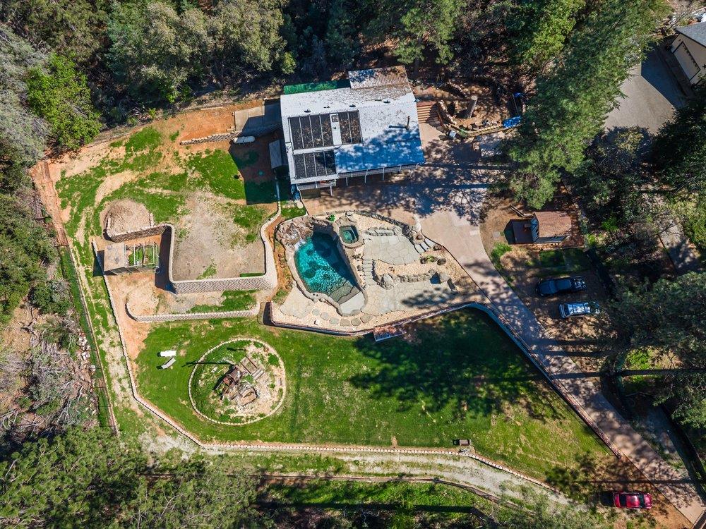 23870 Tokayana Way Colfax, CA 95713 - Photo 78 of 93 an aerial view of a house with garden space ocean and trees all around