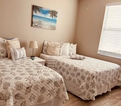 a bedroom with a bed and a lamp