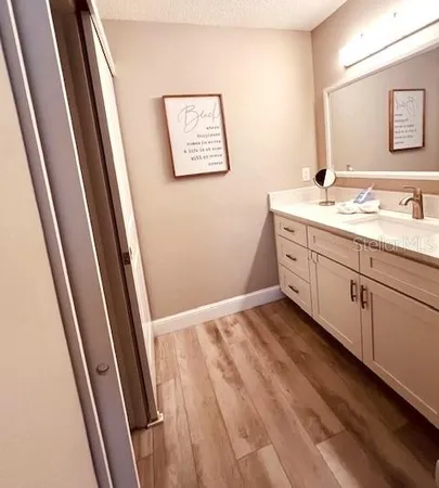 a bathroom with a sink and a mirror