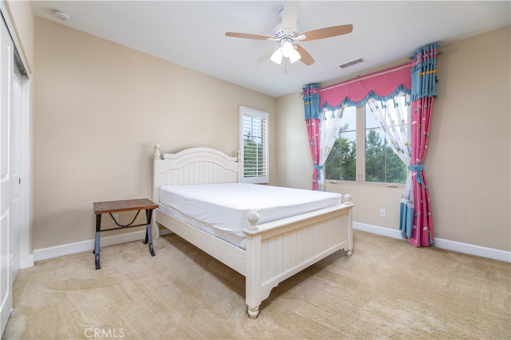 71 Thornapple Irvine, CA 92620 - Photo 12 of 33 a bed sitting in a bedroom next to a window