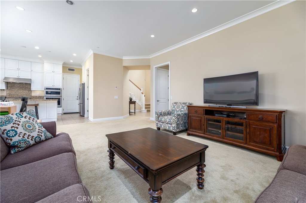 71 Thornapple Irvine, CA 92620 - Photo 16 of 33 a living room with furniture and a flat screen tv