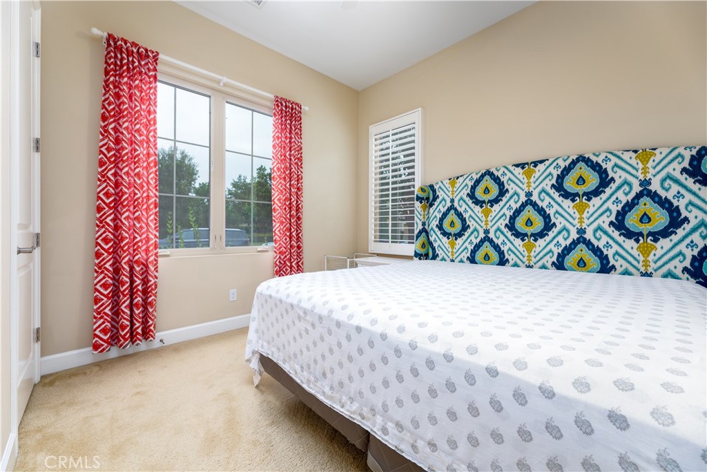 71 Thornapple Irvine, CA 92620 - Photo 20 of 33 a bedroom with a bed and a window
