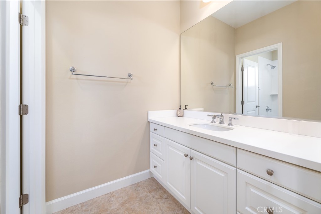 71 Thornapple Irvine, CA 92620 - Photo 25 of 33 a bathroom with a sink and a mirror